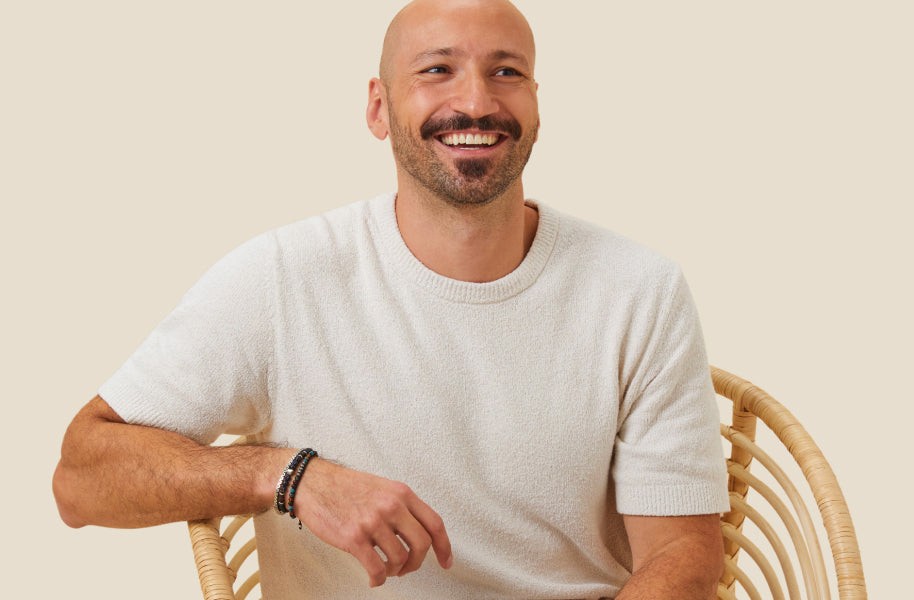 Photo of the founder of MORI sitting in a chair